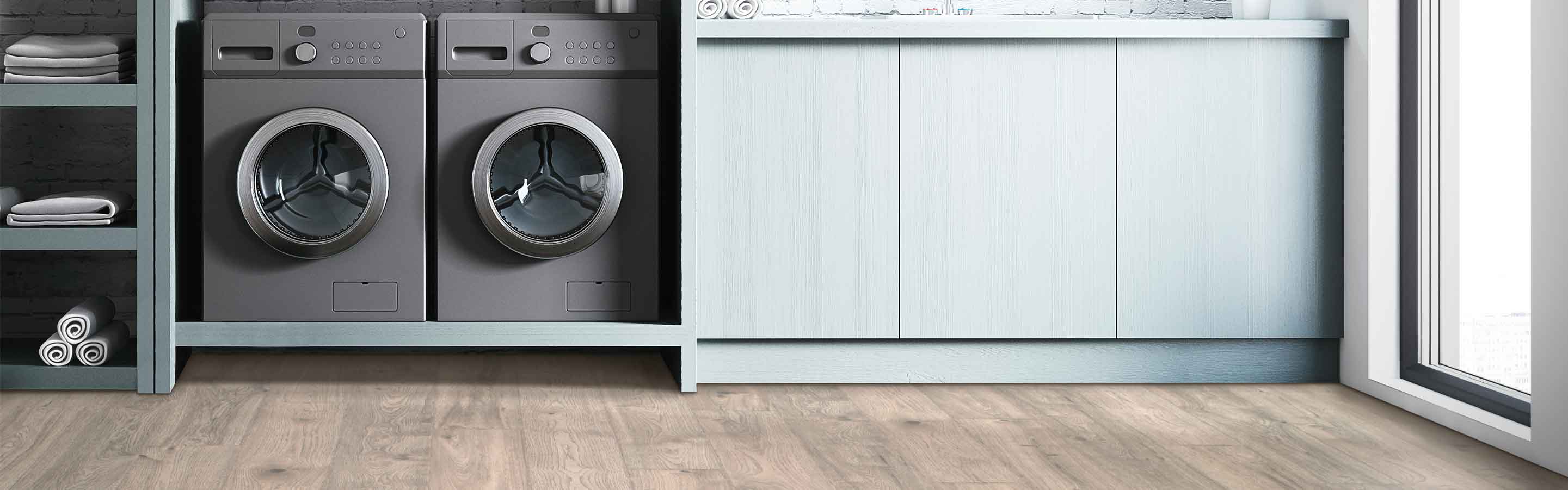 laminate flooring in a laundry room with built in cabinetry